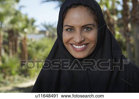 Portrait of muslim woman in black headscarf View Large Photo Image Stock Image - Portrait of muslim woman in black headscarf. Fotosearch