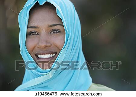 Portrait of muslim woman in blue headscarf, smiling View Large Photo Image Stock Photograph - Portrait of muslim woman in blue headscarf, smiling. Fotosearch