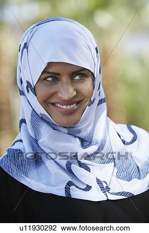 Stock Image - Portrait of muslim woman wearing headscarf. Fotosearch