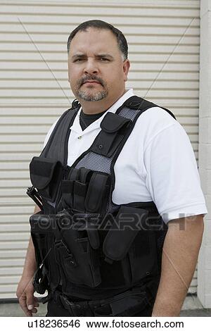 Portrait of security guard in bulletproof vest View Large Photo Image Stock Photograph - Portrait of security guard in bulletproof vest. Fotosearch