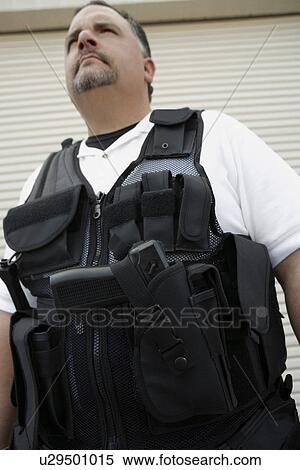 Stock Photography - Portrait of security guard in bulletproof vest. Fotosearch