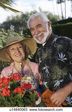 Portrait of senior couple in garden View Large Photo Image Stock Image - Portrait of senior couple in garden. Fotosearch