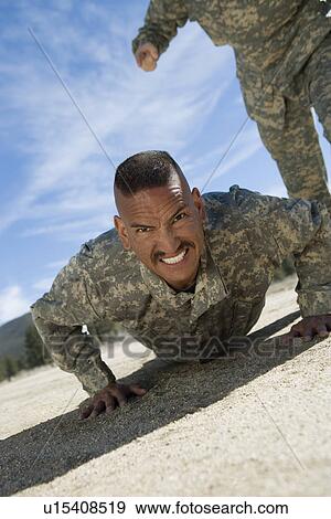 Stock Photo - Portrait of soldier doing pushups. Fotosearch