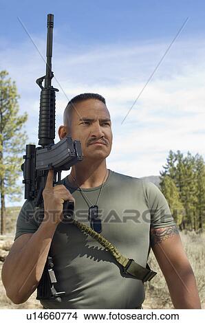 Picture - Portrait of soldier with machine gun. Fotosearch