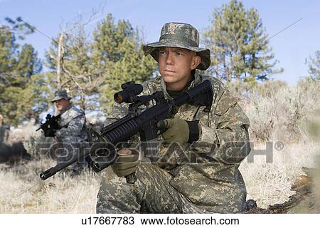Portrait of soldier with machine gun View Large Photo Image Stock Image - Portrait of soldier with machine gun. Fotosearch