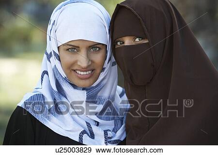Stock Photo - Portrait of two muslim women. Fotosearch