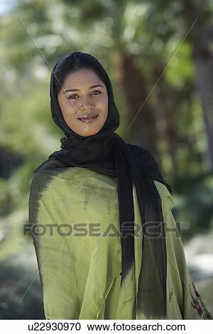 Stock Image - Portrait of young muslim woman. Fotosearch