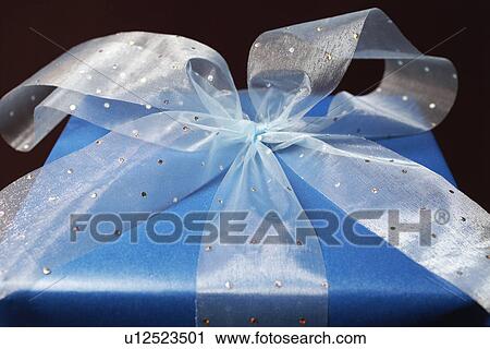Stock Image - Present with ribbon, close-up. Fotosearch