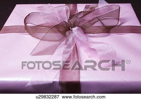 Present with ribbon, close-up View Large Photo Image Stock Photo - Present with ribbon, close-up. Fotosearch