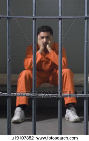 Stock Image - Prisoner in cell. Fotosearch