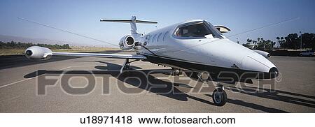 Stock Photo - Private plane on runway. Fotosearch