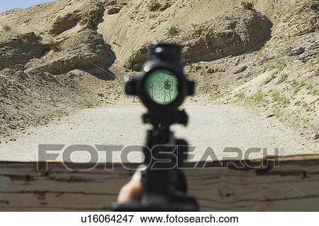 Rifle sight aiming at target on firing range View Large Photo Image Stock Photo - Rifle sight aiming at target on firing range. Fotosearch
