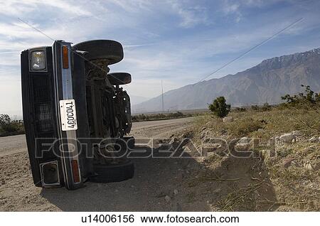 Rolled over truck in desert View Large Photo Image Stock Photograph - Rolled over truck in desert. Fotosearch
