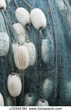 Picture - Rolled up fishing net, close up. Fotosearch