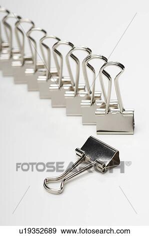 Stock Photo - Row of binder clip on white background. Fotosearch