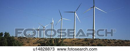Row of wind turbines in desert View Large Photo Image Stock Image - Row of wind turbines in desert. Fotosearch