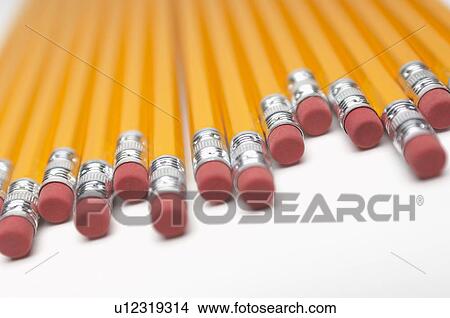 Picture - Row of yellow pencils, close-up of erasers. Fotosearch