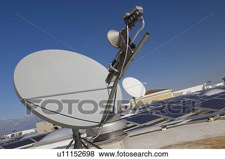 Stock Photo - Satellite Dish with Solar Panels at Solar Power Plant. Fotosearch