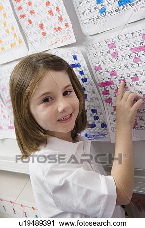 Stock Image - School Pointing to a Date on a Schedule. Fotosearch