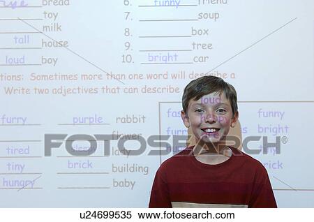 Schoolboy standing in classroom, projection screen behind him View Large Photo Image Stock Photography - Schoolboy standing in classroom, projection screen behind him. Fotosearch