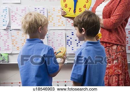 Schoolboys Learning to Tell Time View Large Photo Image Stock Image - Schoolboys Learning to Tell Time. Fotosearch