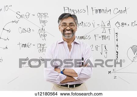 Scientist Standing in Front of Whiteboard View Large Photo Image Picture - Scientist Standing in Front of Whiteboard. Fotosearch