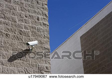 Stock Photo - Security camera on wall. Fotosearch
