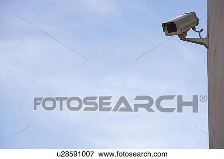 Stock Photo - Security camera on wall. Fotosearch