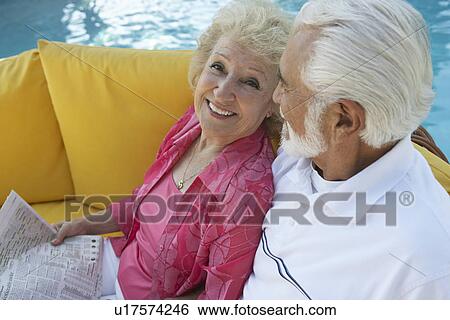 Senior couple relaxing outdoors View Large Photo Image Stock Photograph - Senior couple relaxing outdoors. Fotosearch