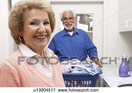 Senior couple with laundry View Large Photo Image Stock Photo - Senior couple with laundry. Fotosearch