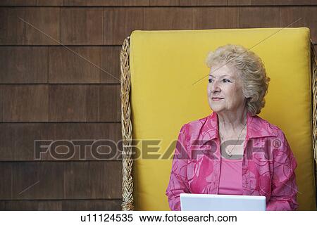 Stock Photography - Senior woman outdoors. Fotosearch