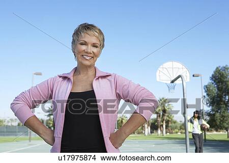 Picture - Senior women on outdoor basketball court, portrait. Fotosearch