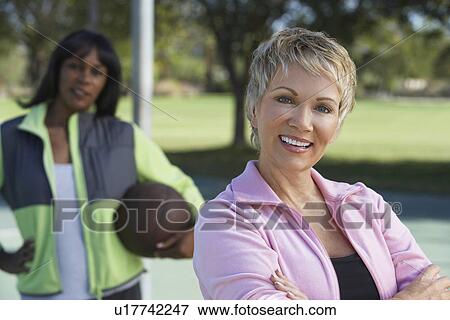 Senior women on outdoor basketball court, portrait View Large Photo Image Stock Photo - Senior women on outdoor basketball court, portrait. Fotosearch