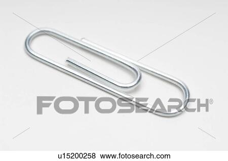 Silver paper clip on white background View Large Photo Image Stock Photo - Silver paper clip on white background. Fotosearch