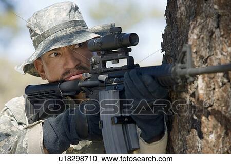 Soldier aiming machine gun, close-up View Large Photo Image Stock Image - Soldier aiming machine gun, close-up. Fotosearch