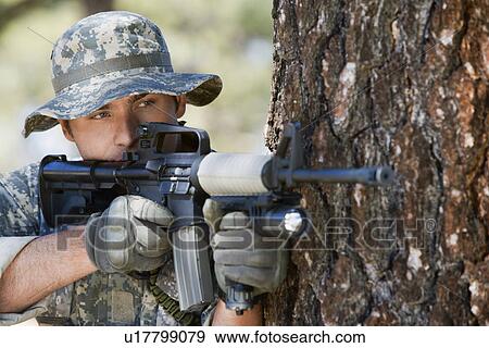 Soldier aiming machine gun, close-up View Large Photo Image Stock Photo - Soldier aiming machine gun, close-up. Fotosearch