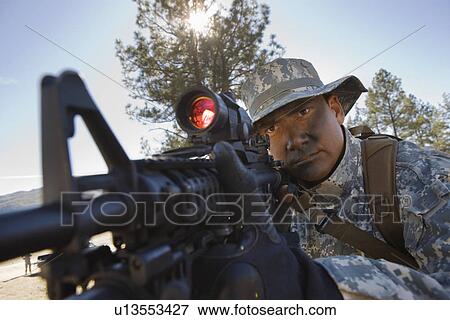 Soldier pointing rifle View Large Photo Image Stock Photo - Soldier pointing rifle. Fotosearch