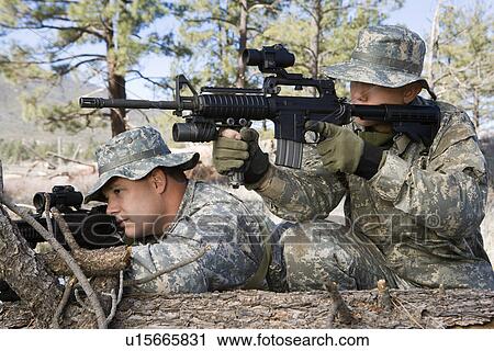Soldiers aiming machine gun, leaning on log View Large Photo Image Stock Image - Soldiers aiming machine gun, leaning on log. Fotosearch