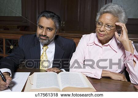 Solicitor and client in court View Large Photo Image Stock Photo - Solicitor and client in court. Fotosearch