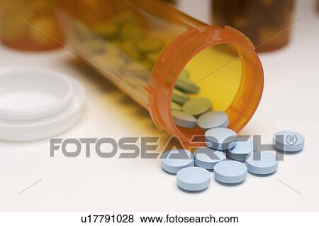 Spilt bottle of pills, close-up View Large Photo Image Stock Photo - Spilt bottle of pills, close-up. Fotosearch