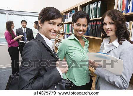 Stock Photo - Students in library. Fotosearch
