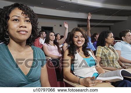 Stock Photograph - Students sitting in lecture theatre during lesson. Fotosearch