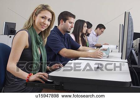 Stock Photo - Students working in computer classroom. Fotosearch