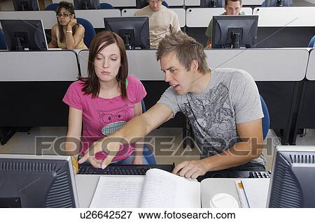 Stock Photo - Students working in computer classroom. Fotosearch