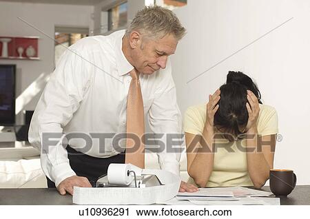 Stock Image - Tax Accountant Giving Woman Bad News. Fotosearch