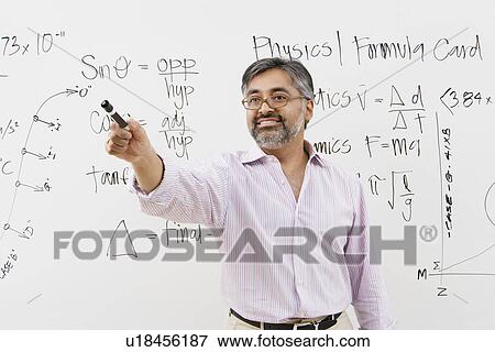 Teacher in Front of Whiteboard View Large Photo Image Stock Photo - Teacher in Front of Whiteboard. Fotosearch