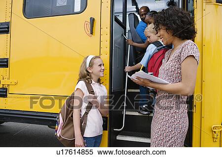 Teacher Loading Elementary Students on School Bus View Large Photo Image Stock Photography - Teacher Loading Elementary Students on School Bus. Fotosearch