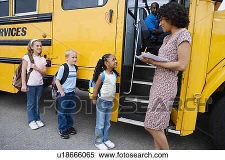 Teacher Loading Elementary Students on School Bus View Large Photo Image Stock Photography - Teacher Loading Elementary Students on School Bus. Fotosearch