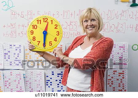 Teacher Showing Class a Clock View Large Photo Image Stock Image - Teacher Showing Class a Clock. Fotosearch