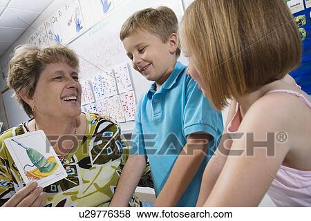 Teacher Showing Elementary Students Flash Cards View Large Photo Image Stock Photo - Teacher Showing Elementary Students Flash Cards. Fotosearch